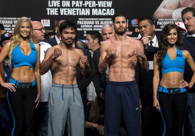 Manny Pacquiao and Chris Algieri pose for pictures after the weigh-in for their WBO Welterweight title clash Manny Pacquiao Chris Algieri