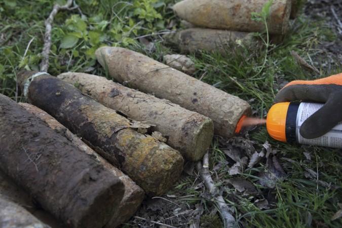 A bomb-disposal expert uses paint to mark a gas shell after a French farmer found them during the autumn potato harvest in Colincamps, the scene of a WWI battlefield in the Somme 98 years ago. It is quite common to find bombs from World War II in France. On 23 November, a World War II British bomb was discovered in Rennes. World War II bomb found in France