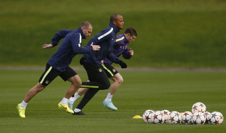 Manchester City's Pablo Zabaleta (L-R), Vincent Kompany and James Milner warm-up during a training session. Manchester City