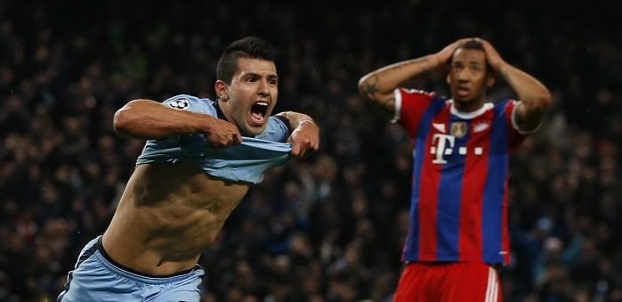 Manchester City striker Sergio Aguero cannot hide his delight after scoring the winning goal as Bayern Munich defender Jerome Boateng looks on in despair Sergio Aguero Manchester City Jerome Boateng Bayern Munich