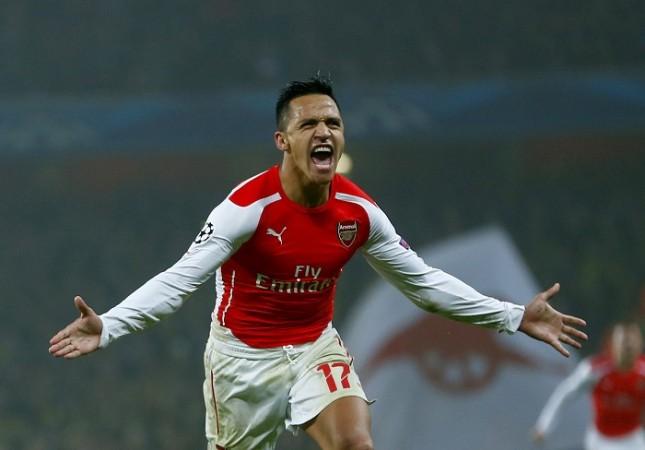 Arsenal forward Alexis Sanchez celebrates after scoring against Borussia Dortmund in the Champions League Alexis Sanchez Arsenal