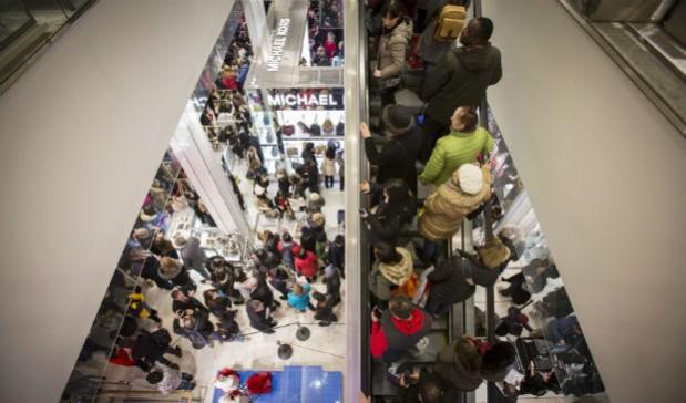 Shoppers enter Macy's in New York. (File photo) Black Friday