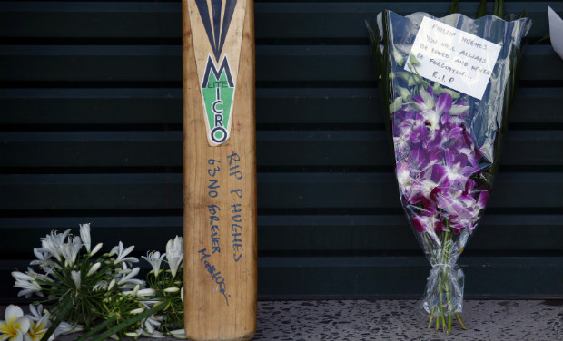 Messages and flowers of tribute to Australian cricketer Phillip Hughes can be seen outside the main gates of the Sydney Cricket Ground (SCG). Phillip Hughes