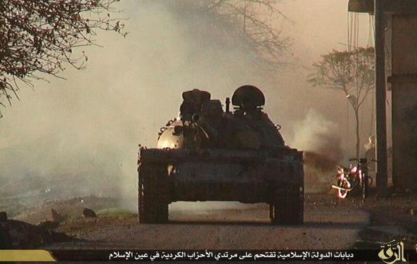 ISIS military tanks attacking Kurdish position inside Kobane from area near Turkey ISIS military tanks attacking Kurdish position inside Kobane from area near Turkey