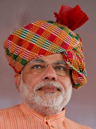 Modi attends an election campaign rally ahead of the state assembly elections at Fagvel village in Gujarat on 11 October 2012. Modi