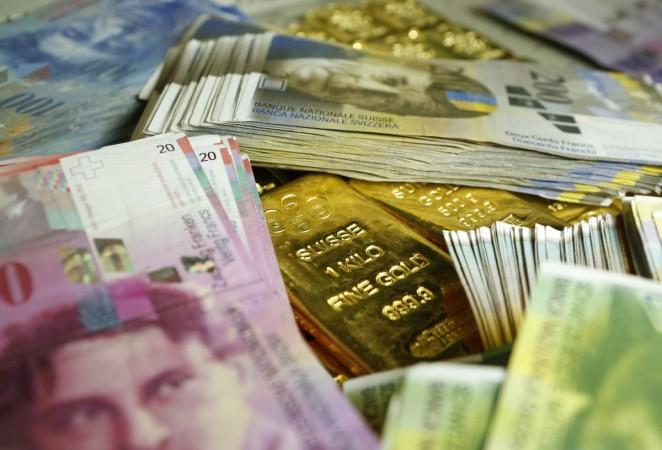Gold bars and Swiss Franc