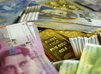 Gold bars and Swiss Franc