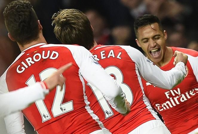 Arsenal forward Alexis Sanchez celebrates with his teammates after scoring against Southampton in their English Premier League game Alexis Sanchez Arsenal Nacho Monreal Olivier Giroud
