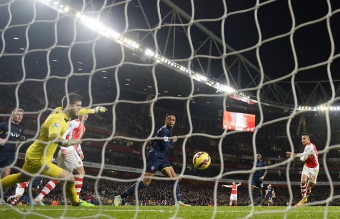 Arsenal forward Alexis Sanchez scores the winner against Southampton in their English Premier League game Fraser Forster Southampton Alexis Sanchez Arsenal