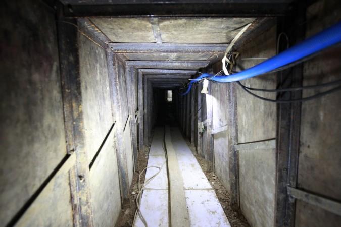 A tunnel under construction in China has collapsed, trapping at least 20 people China tunnel collapse