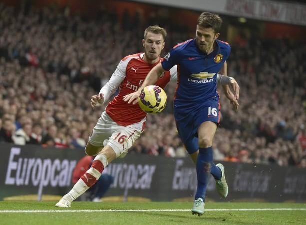 Michael Carrick (L) is not one of the players expected to be shown the door by Manchester United Aaron Ramsey Arsenal Michael Carrick Manchester United