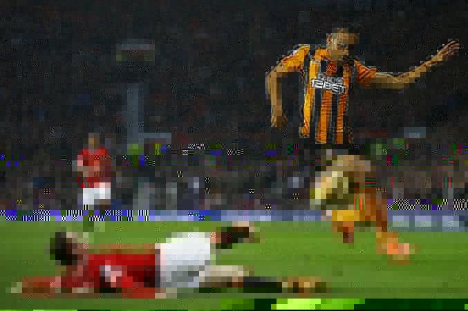 Manchester United forward Wayne Rooney challenges Hull City wide man Ahmed Elmohamady in their English Premier League game Wayne Rooney Manchester United Hull City Elmohamady