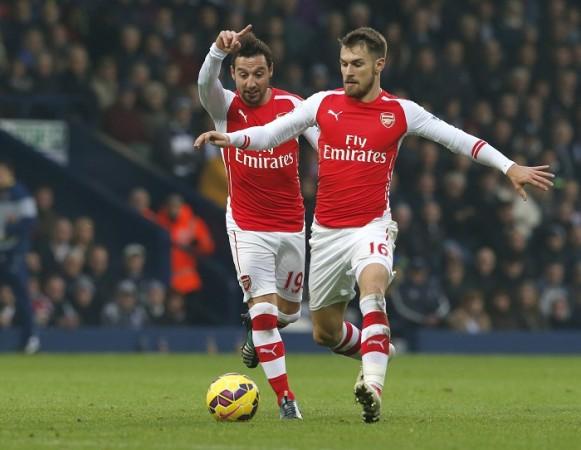 Arsenal midfielder Aaron Ramsey will be the cynosure in the English Premier League game against Stoke City Aaron Ramsey Santi Cazorla Arsenal
