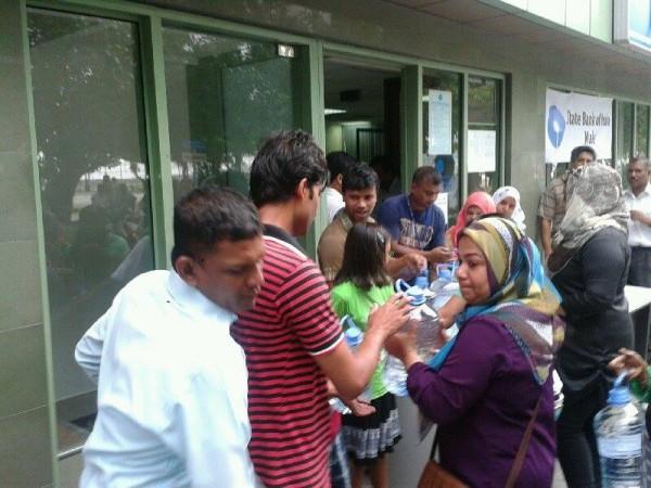 Water Distribution at a State Bank of India outlet in Male, Maldives. water distribution
