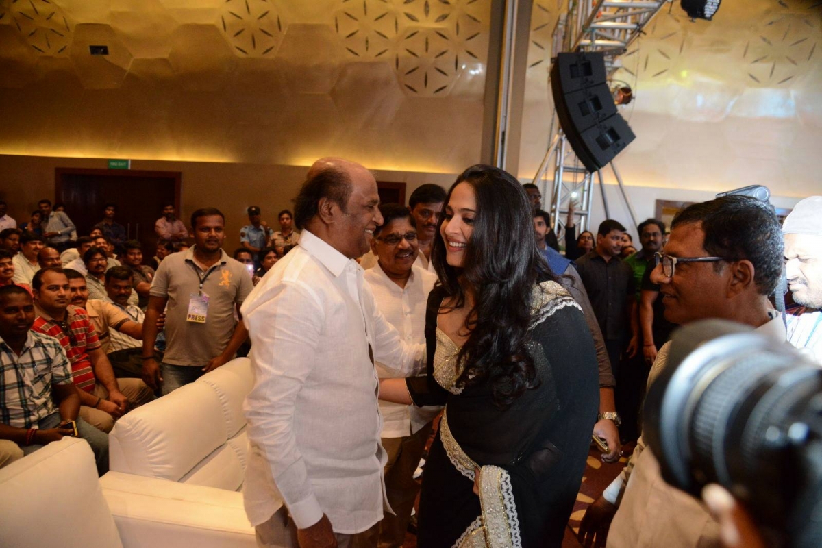 Anushka Shetty greeting Rajinijkanth during 