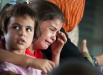 A child cries in a military helicopter after being evacuated by Iraqi forces from Amerli, north of Baghdad after the town was attacked by ISIS.