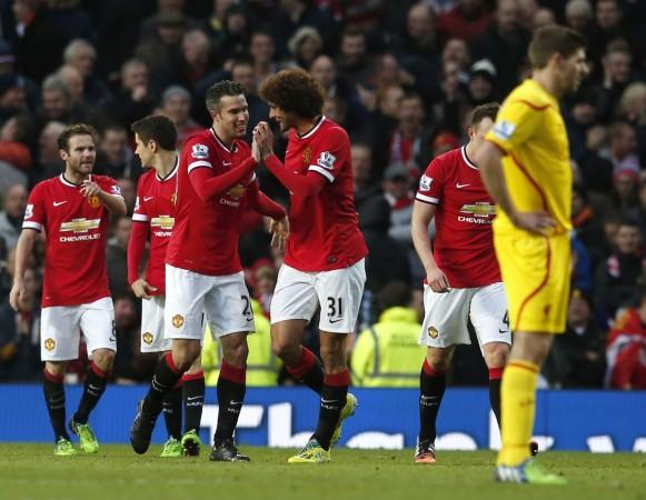 Manchester United's Robin van Persie (3rd L) celebrates with Marouane Fellaini after scoring his team's third goal during their English Premier League soccer match against Liverpool at Old Trafford Manchester United