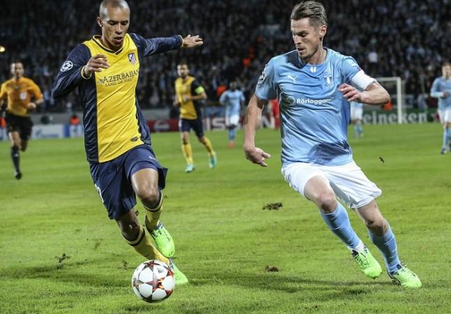 Atletico Madrid defender Miranda (R) could be set for a move to Manchester United in January Miranda Atletico Madrid Malmo Markus Rosenberg