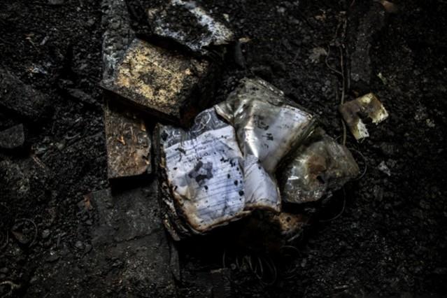 Burnt books lie on the floor at the Army Public School in Peshawar where Taliban launched an attack on 16 December. Peshawar attack