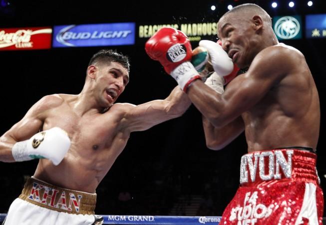 Amir Khan punches Devon Alexander of the US during the welterweight fight in Las Vegas, Nevada on 13 December. The shorts he wore for the fight, will be donated for the rebuilding of Peshawar massacre school. Amir Khan's shorts to be donated for rebuilding Peshawar massacre school