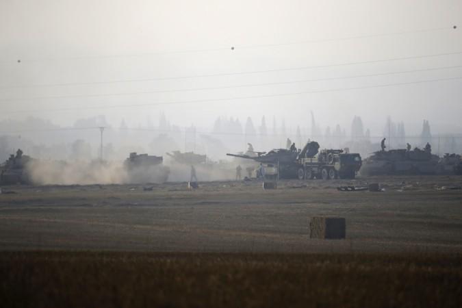 Israeli army tanks are seen outside the central Gaza Strip Israeli army tanks are seen outside the central Gaza Strip