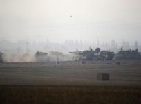 Israeli army tanks are seen outside the central Gaza Strip