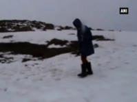 Tourists enjoy snowfall in Kashmir