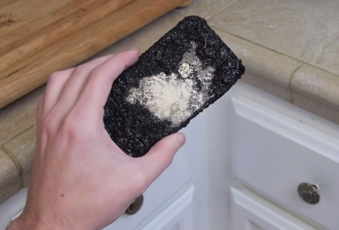 A destroyed iPhone 6 after it was boiled in a pan of Coca Cola.