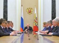 Russian President Vladimir Putin (C) chairs the Security Council in Moscow's Kremlin, December 26, 2014. Putin has signed a new military doctrine, naming NATO expansion among key external risks, the Kremlin said on Friday, days after Ukraine made fresh st