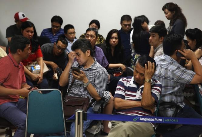 Family members of passengers onboard AirAsia flight QZ8501 react at a waiting area in Juanda International Airport, Surabaya December 28, 2014 Family members of passengers onboard AirAsia flight QZ8501 react at a waiting area in Juanda International Airport, Surabaya December 28, 2014