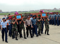 First two bodies being brought to Surabaya military base.