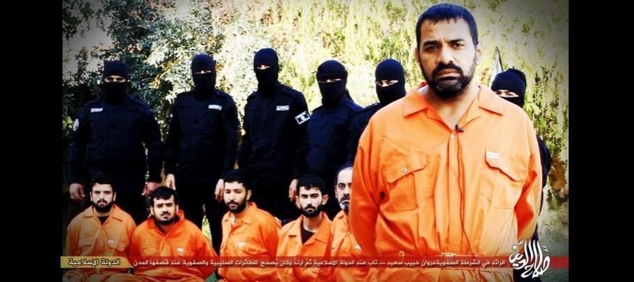 ISIS in early January released still pictures of a video which shows the mass execution of Iraqi Police officers who 'spied' for US coalition. The grieving and angry father of one of the officials shown here has apparently gunned down seven Islamic State militants as revenge against the death of his son. ISIS released still pictures of an upcoming video which shows the mass execution of Iraqi Police officers who 'spied' for US coalition.