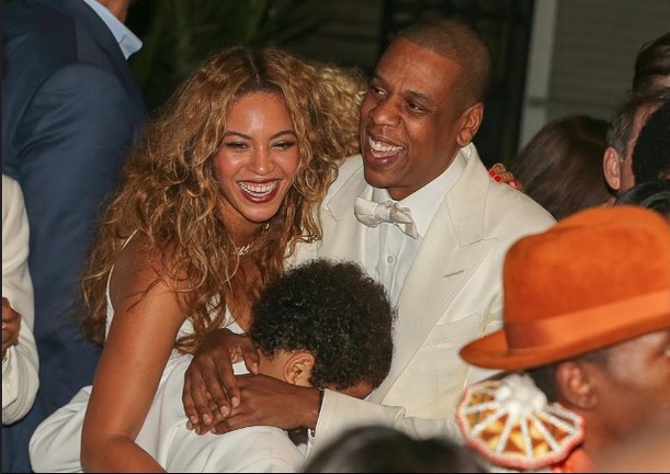Blu Ivy trying hide in her daddy's lap