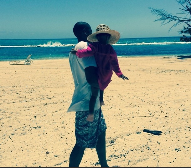 Taking a stroll with daddy Jay Z at the beach