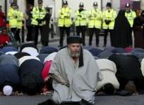Muslim cleric, Abu Hamza al-Masri, is seen leading prayers outside the North London Central Mosque, in Finsbury Park, north London in this January 24, 2003 file photograph.