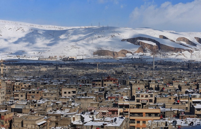 A general view shows the Duma neighborhood of Damascus covered in snow. Syria Snow