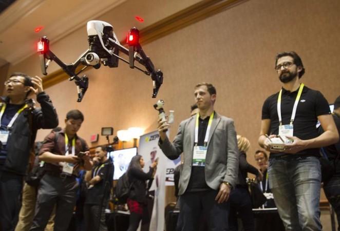 Michael Perry (R) flies a DJI Inspire 1 flying platform during the 2015 International Consumer Electronics Show (CES) in Las Vegas. The remote control quadcopter, with 4K video camera and three-axis gimbal, is a sophisticated filmmaking system straight from the box, said DJI's Randy Braun. The system retails for $2,890.00. Michael Perry (R) flies a DJI Inspire 1 flying platform during the 2015 International Consumer Electronics Show