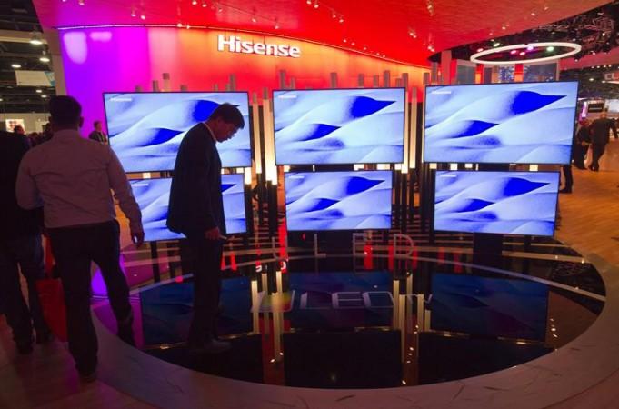 A man looks over a display of Hisense 4K televisions during the 2015 International Consumer Electronics Show A man looks over a display of Hisense 4K televisions during the 2015 International Consumer Electronics Show