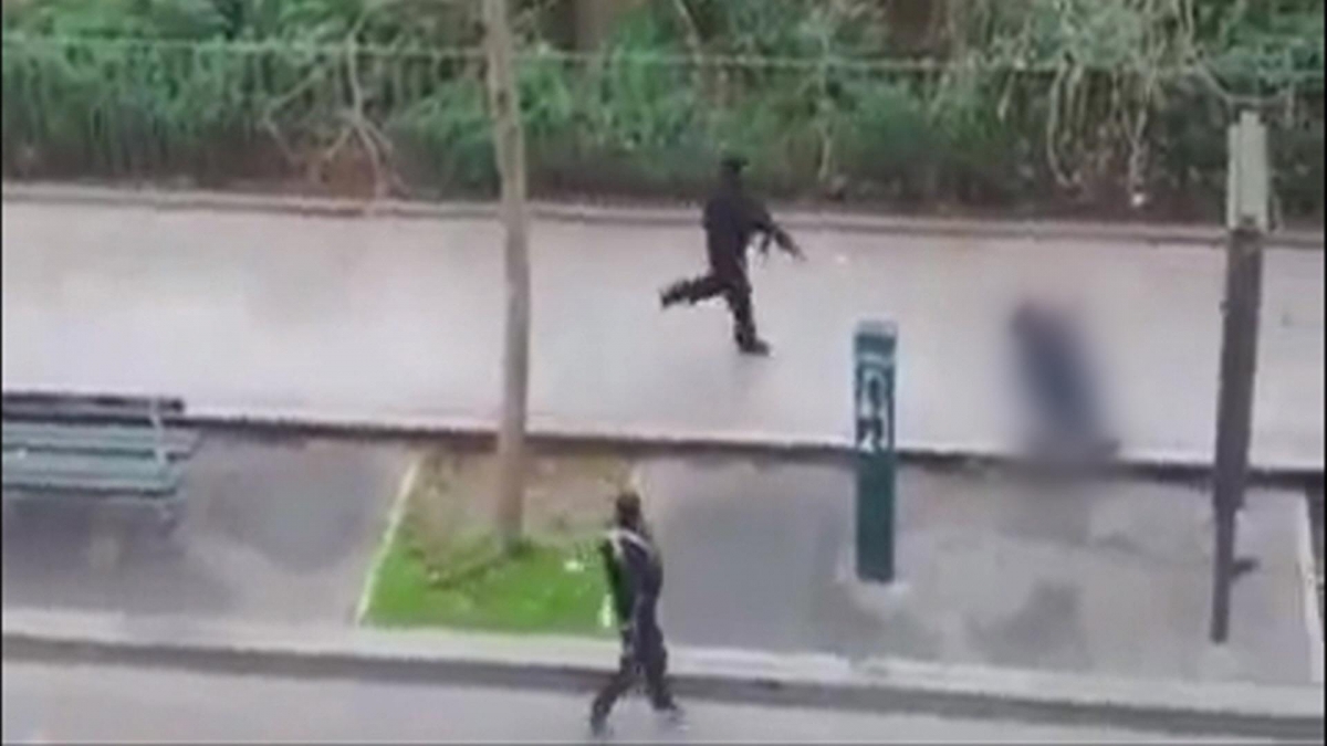 The video shows one of the two gunmen killing a wounded Paris police office outside Charlie Hebdo. The video shows one of the two gunmen killing a wounded Paris police office outside Charlie Hebdo.