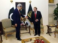 U.S. Secretary of State John Kerry (L) gestures to Pakistan Prime Minister Nawaz Sharif shortly after arriving in Islamabad, Pakistan January 12, 2015
