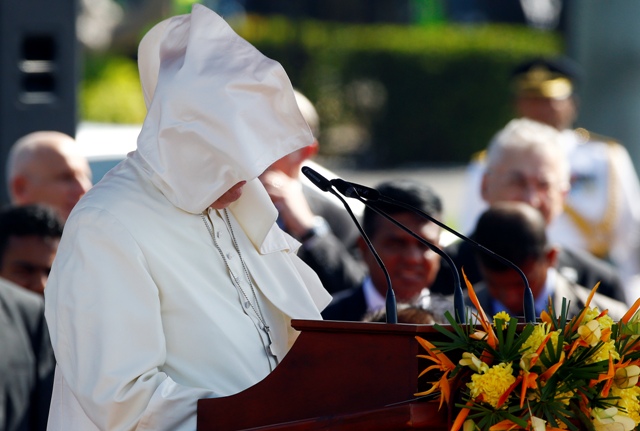 A gust of wind blows the mantle of Pope Francis as he speaks at the Colombo airport. Pope Francis in Sri Lanka