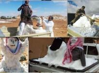 Saudi citizens enjoying snowmen in the northern part of the country