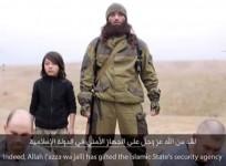 ISIS prpaganda video shows a child soldier shooting dead two Russian Spies