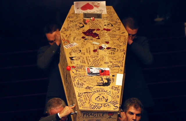 Pallbearers carry the coffin of late satirical French magazine Charlie Hebdo cartoonist Bernard Verlhac. Charlie Hebdo Paris Attack Funeral