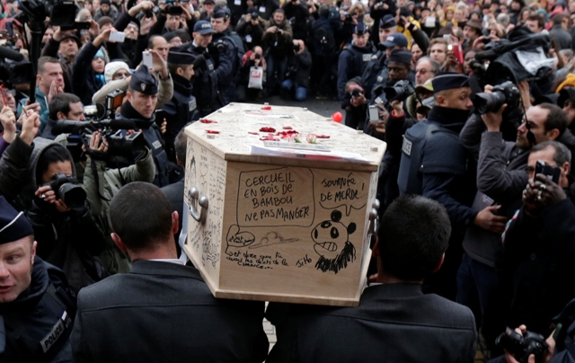 Pallbearers carry the coffin of Bernard Verlhac near Paris. Charlie Hebdo Paris Attack Funeral