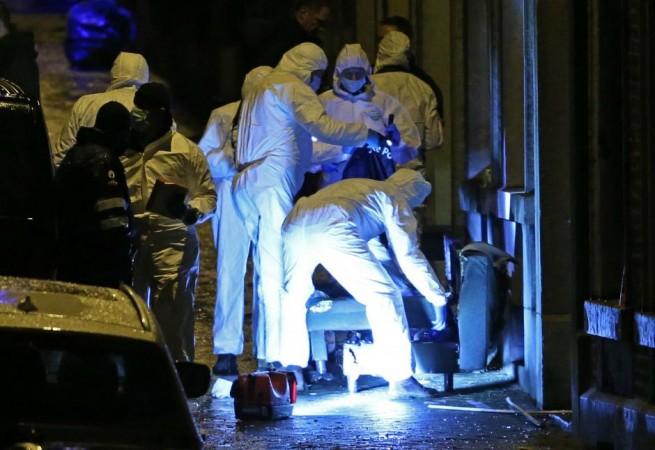 Belgian police inspect the entrance of an apartment in central Verviers, a town between Liege and the German border, in the east of Belgium January 15, 2015. At least two people were killed when Belgian counter-terrorist police raided an apartment used by