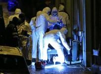 Belgian police inspect the entrance of an apartment in central Verviers, a town between Liege and the German border, in the east of Belgium January 15, 2015. At least two people were killed when Belgian counter-terrorist police raided an apartment used by