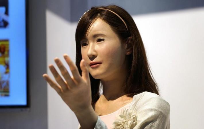 ChihiraAico, a communication android robot, gestures to show goers at the Toshiba booth at the International Consumer Electronics show