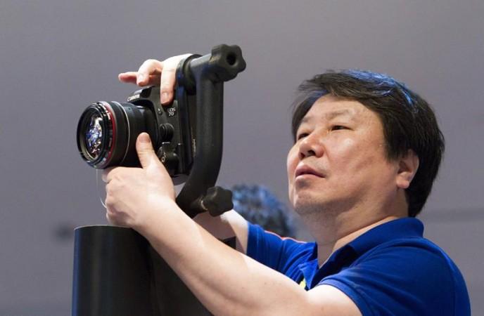 Kim Kyu-sung of South Korea holds a Canon 7D Mark II digital camera during the 2015 International Consumer Electronics Show Kim Kyu-sung of South Korea holds a Canon 7D Mark II digital camera during the 2015 International Consumer Electronics Show