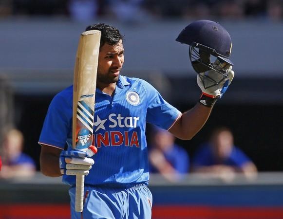 India opener Rohit Sharma celebrates getting to his century against Australia in their tri-series match Rohit Sharma India